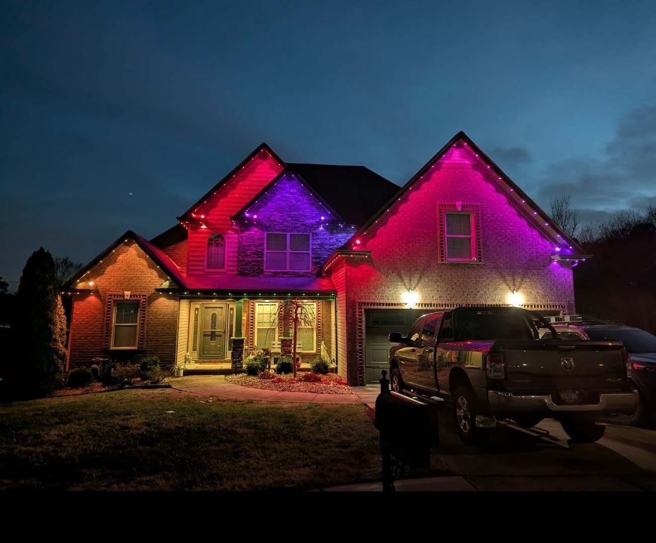 Home with colorful pink and purple Govee permanent lighting